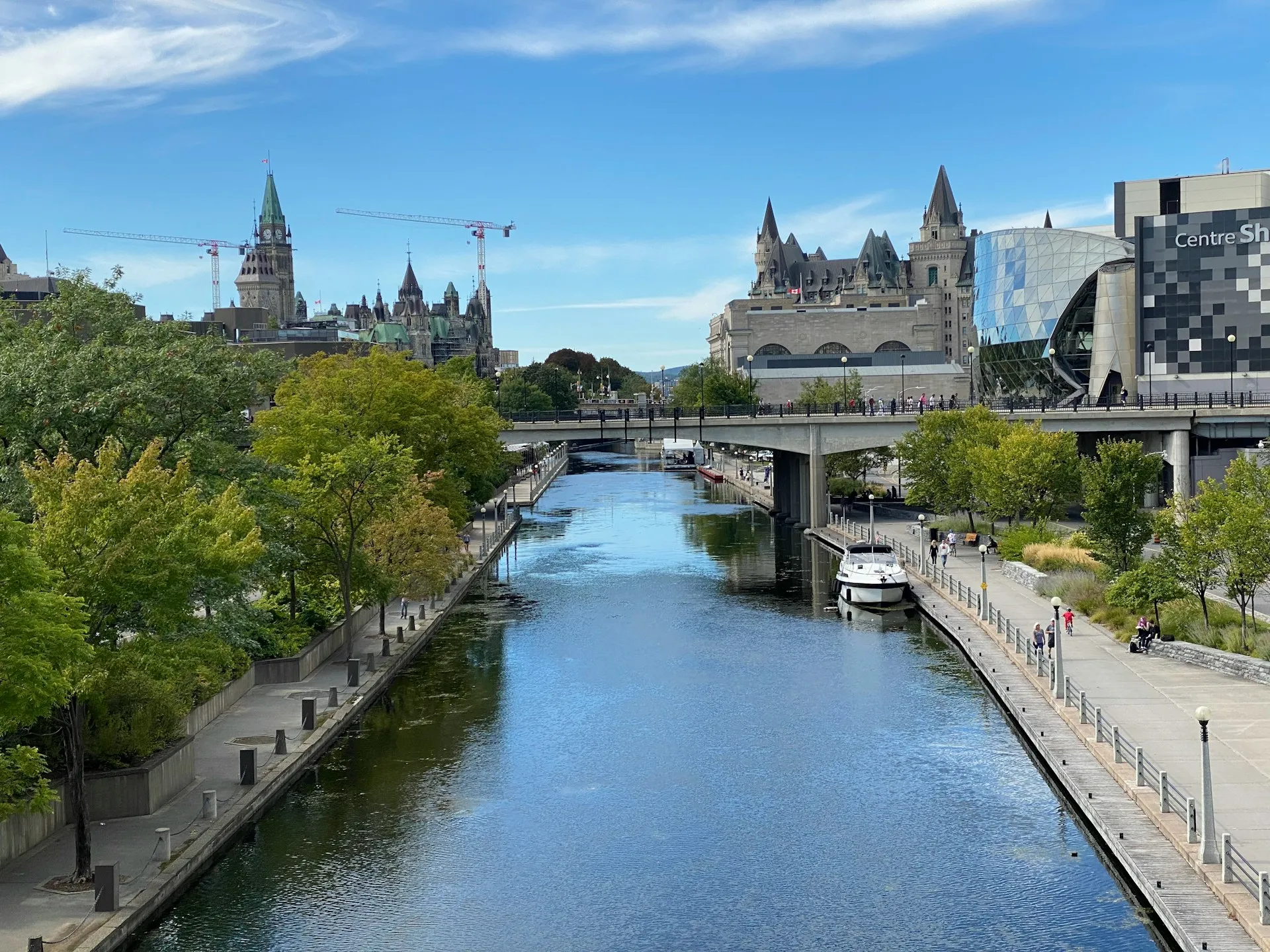 The Rideau Canal running through central Ottawa, with Parliament Hill's Peace Tower and the Château Laurier above it