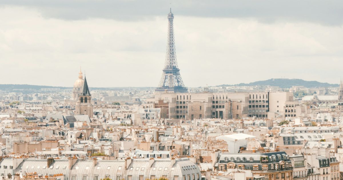 A view across the rooftops of Paris towards the Eiffel Tower, the city where monday.com's satellite office took on The Ultimate Challenge
