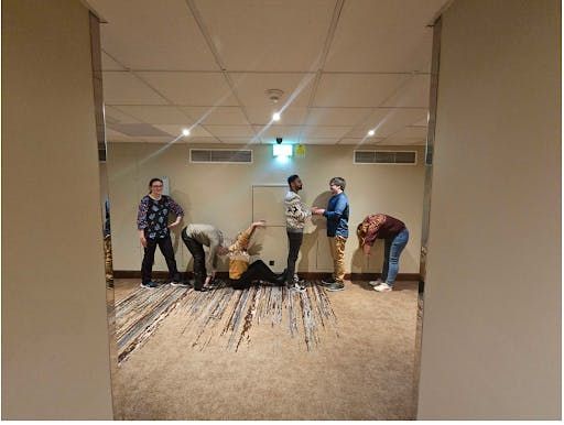 Roche Diagnostics team participating in an indoor team building activity in London, England