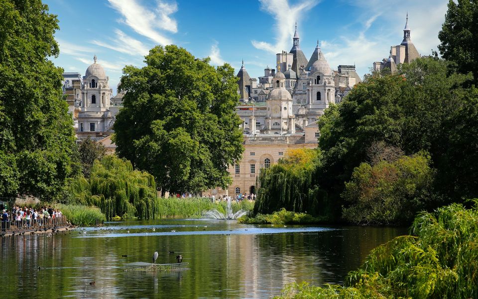 Hyde Park and Kensington Gardens in central London with open green spaces and the Serpentine lake
