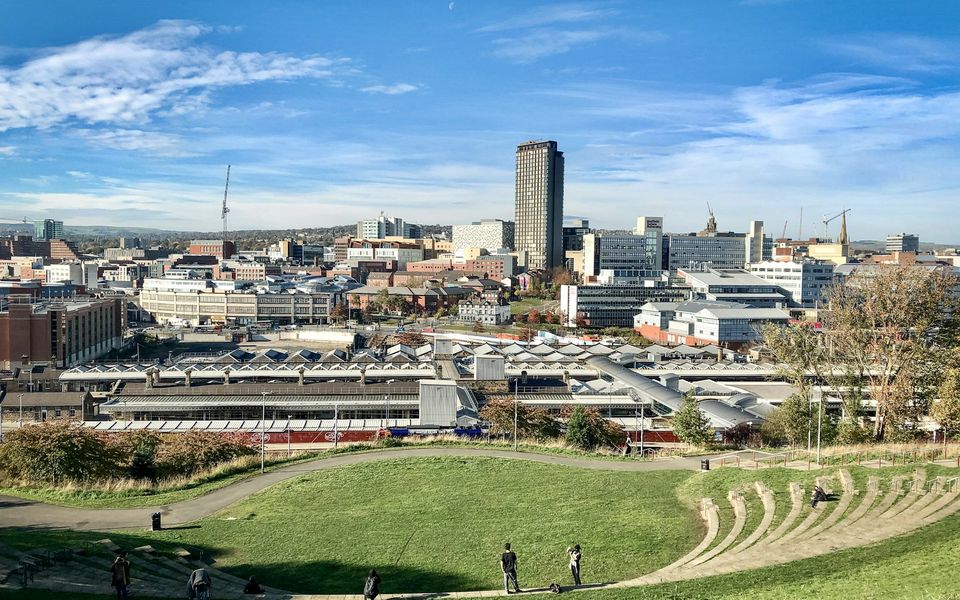 Sheffield city skyline viewed from a green hillside