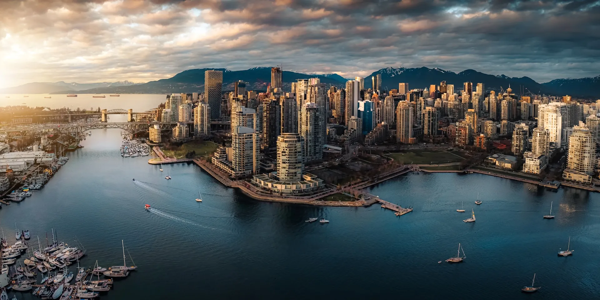 Vancouver's downtown peninsula and False Creek at sunset, with the North Shore mountains behind