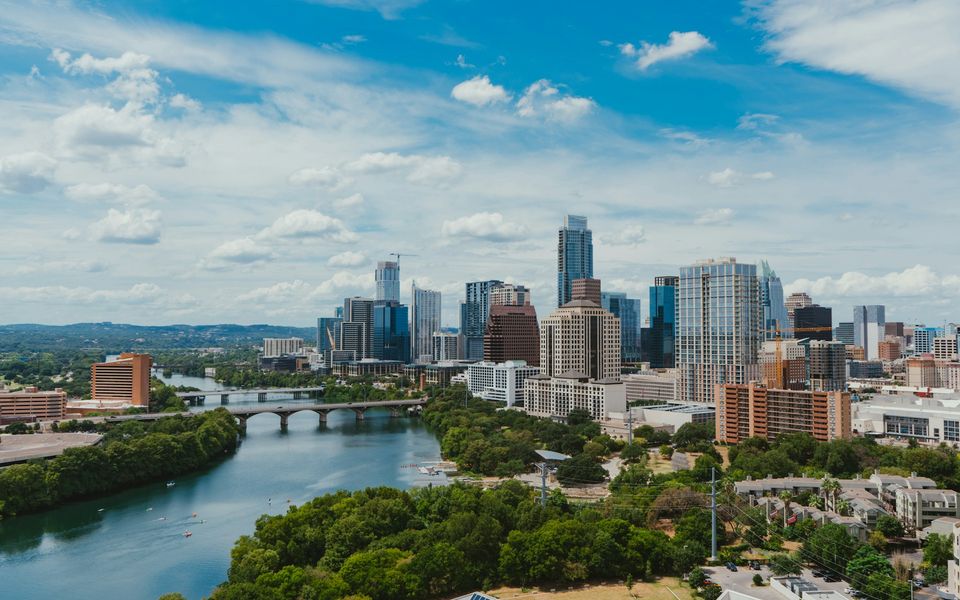 Austin skyline and riverfront under a blue sky
