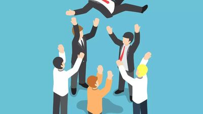 An isometric illustration of a business team tossing their red-haired colleague into the air to celebrate a major success or milestone against a solid blue background.